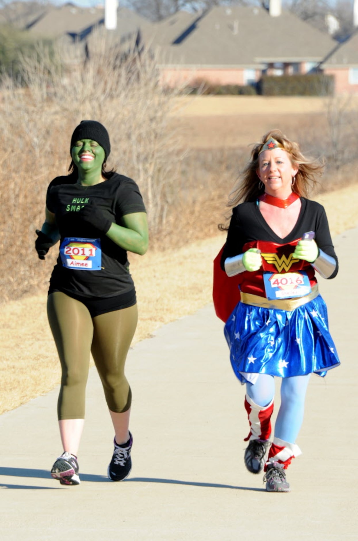 Hulk Aimee Swenson and Wonder Woman Shelley Huskins run together in the Superman 5k Run....