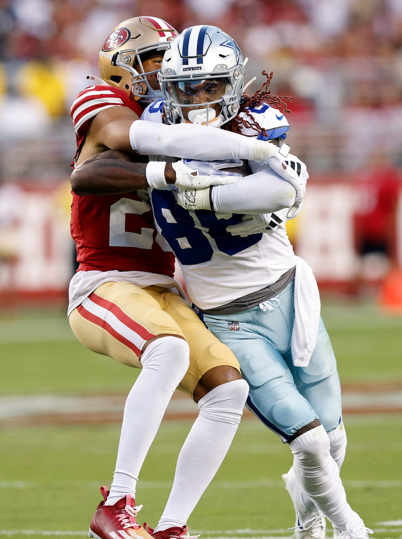 Dallas Cowboys wide receiver CeeDee Lamb (88) is wrapped up by San Francisco 49ers...