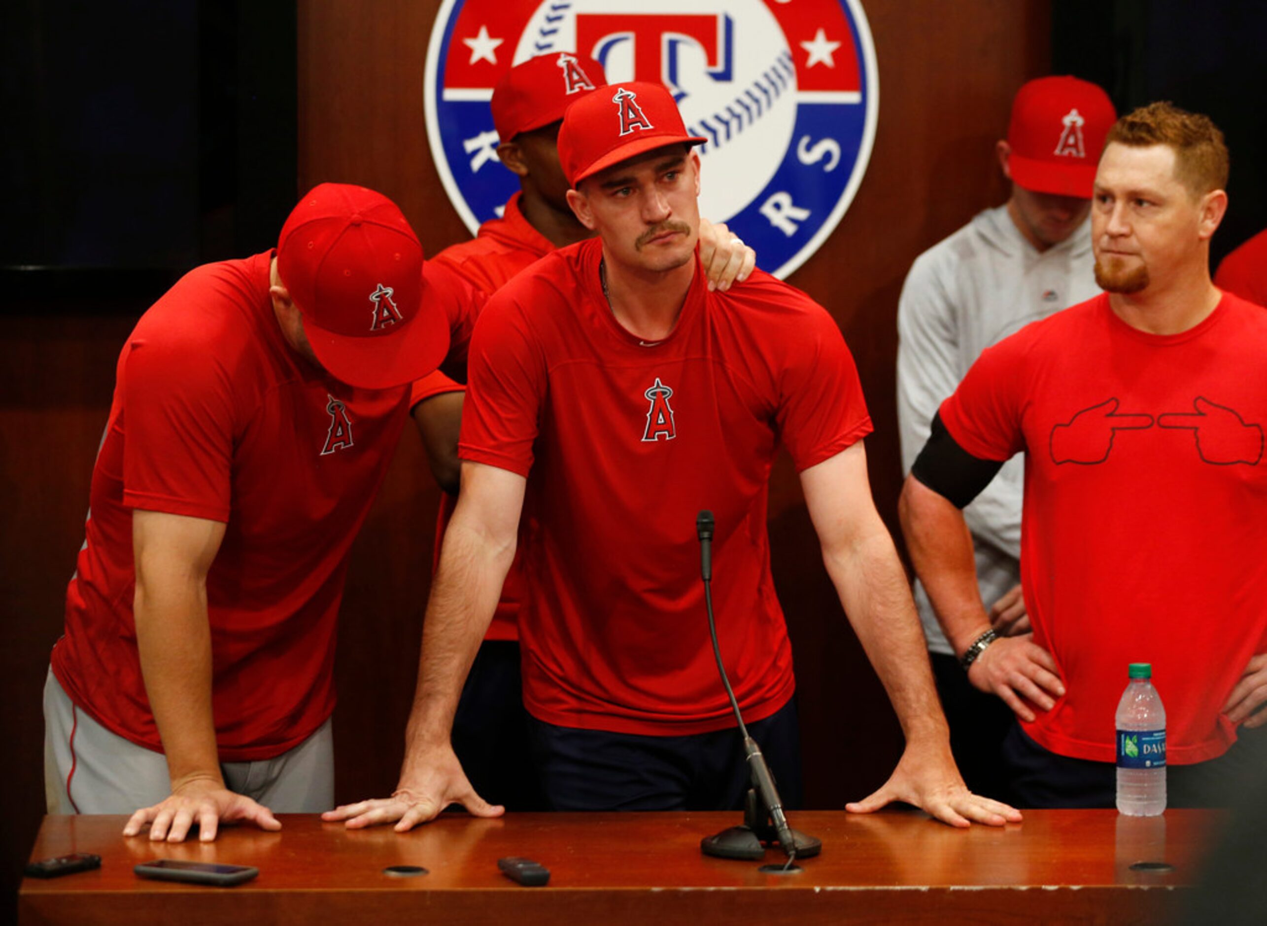 Los Angeles Angels center fielder Mike Trout (27) consoles Los Angeles Angels starting...