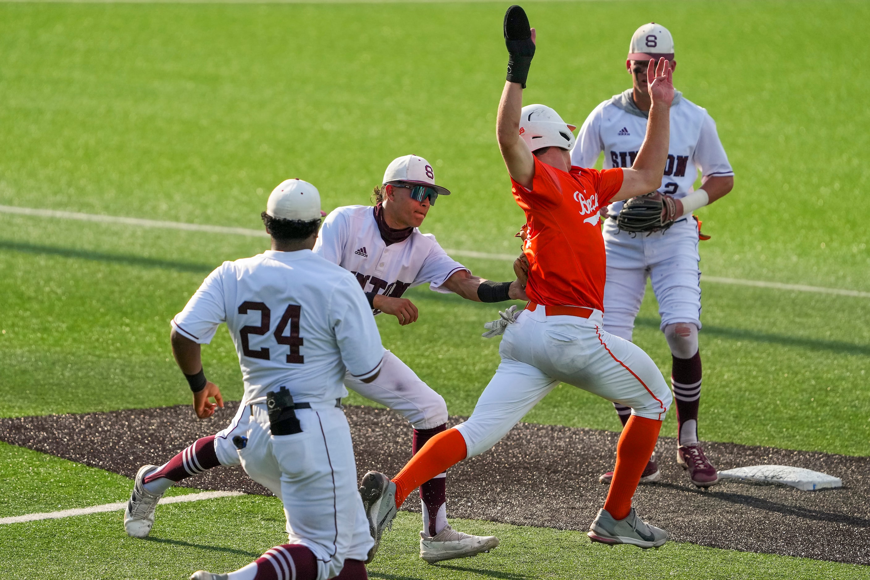 Celina outfielder RJ Ruais (89) is tagged out by Sinton second baseman Marco Gonzales (8) as...