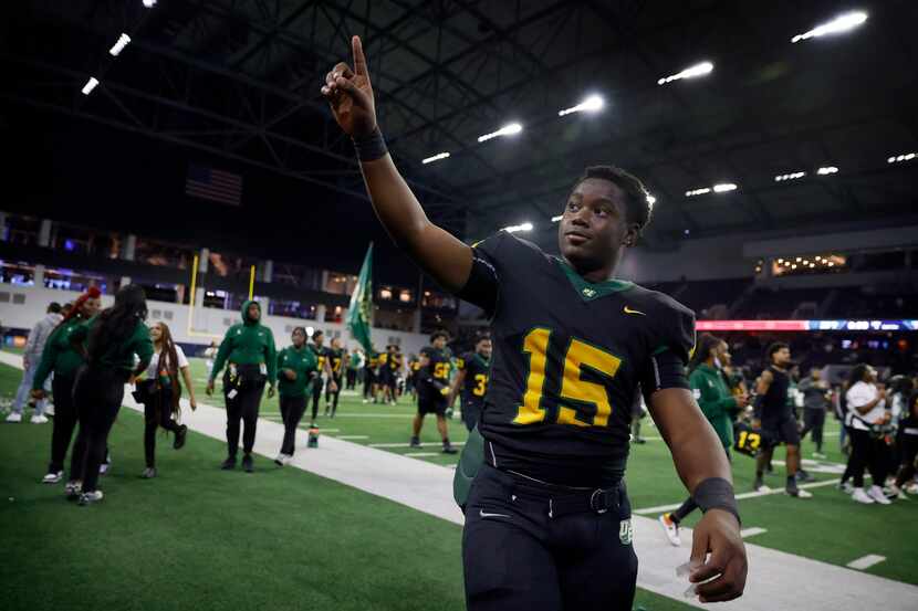 DeSoto quarterback Darius Bailey (15) points to the fans after defeating Denton Guyer in the...