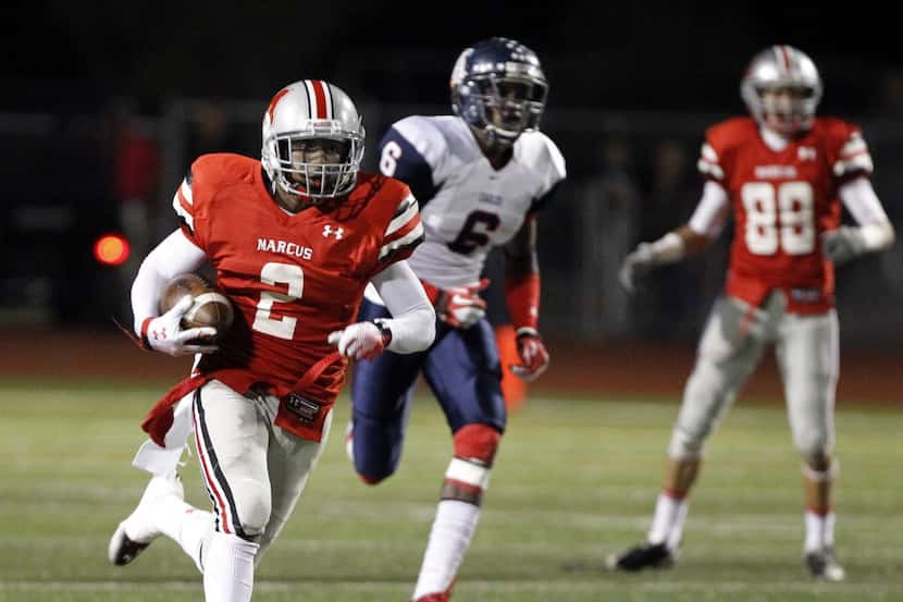 Marcus' Deion Sanders Jr (2) runs a reverse for a long gain during the first quarter of UIL...