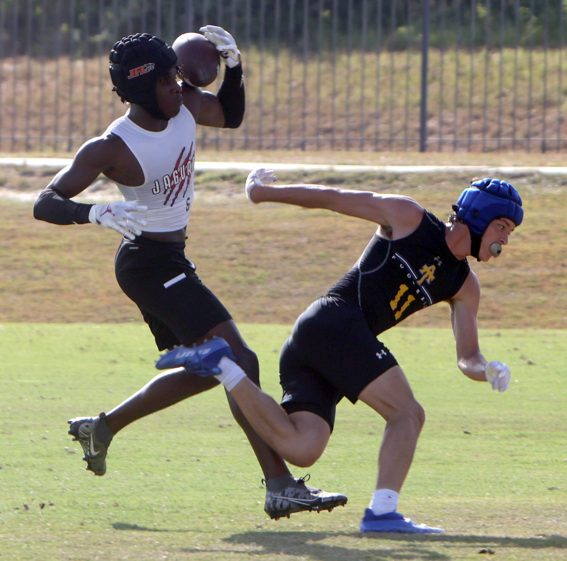 Mesquite Horn defensive back Amarion Atwood (6) pulls in an 
over-the-shoulder interception...