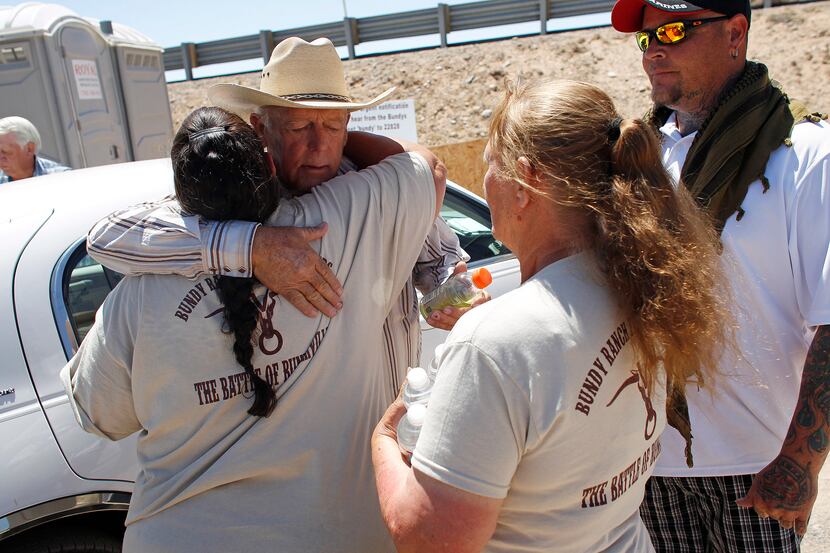 Rancher Cliven Bundy hugged a supporter before holding a news conference near Bunkerville,...
