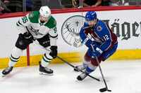 Dallas Stars defenseman Thomas Harley, left, tries to knock the puck away from Colorado...