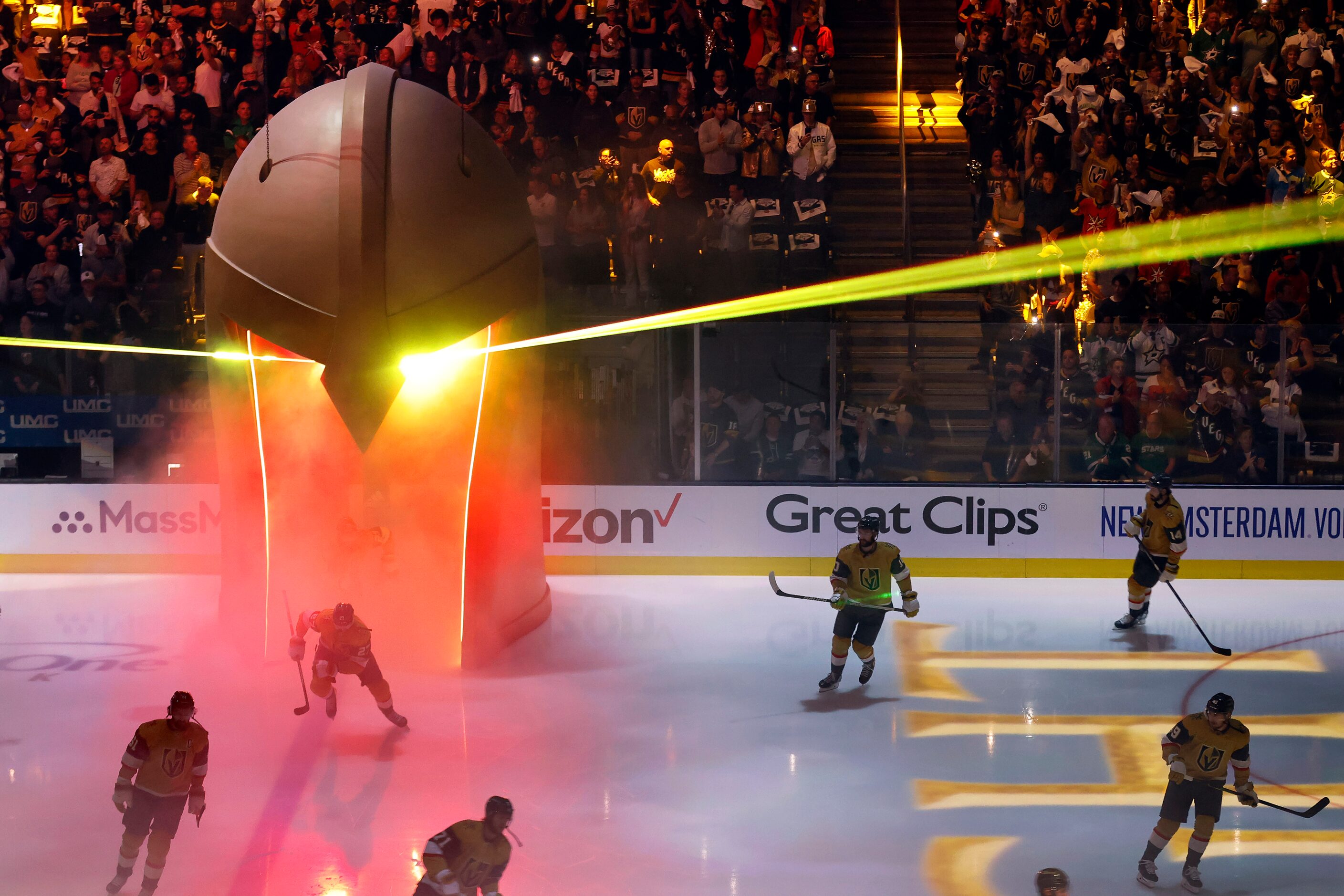 The Vegas Golden Knights hockey team takes the ice through a knights helmet before facing...