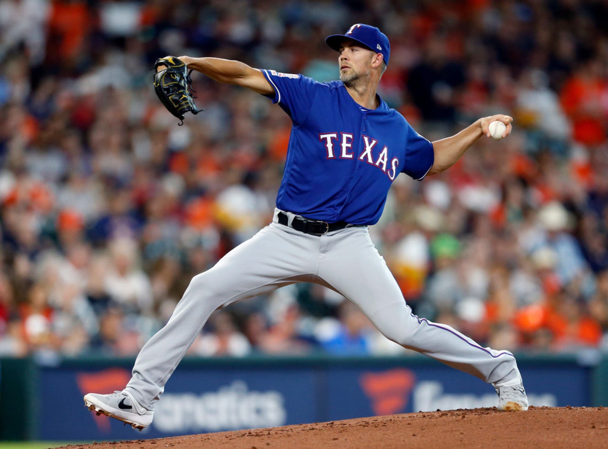 HOUSTON, TEXAS - JULY 19: Mike Minor #23 of the Texas Rangers pitches in the first inning...