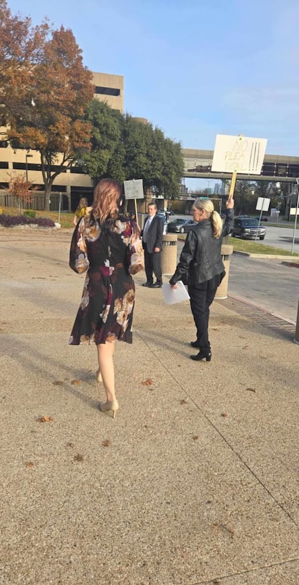 Janet Vanderslice's family demonstrated outside the Dallas County courthouse on Tuesday.