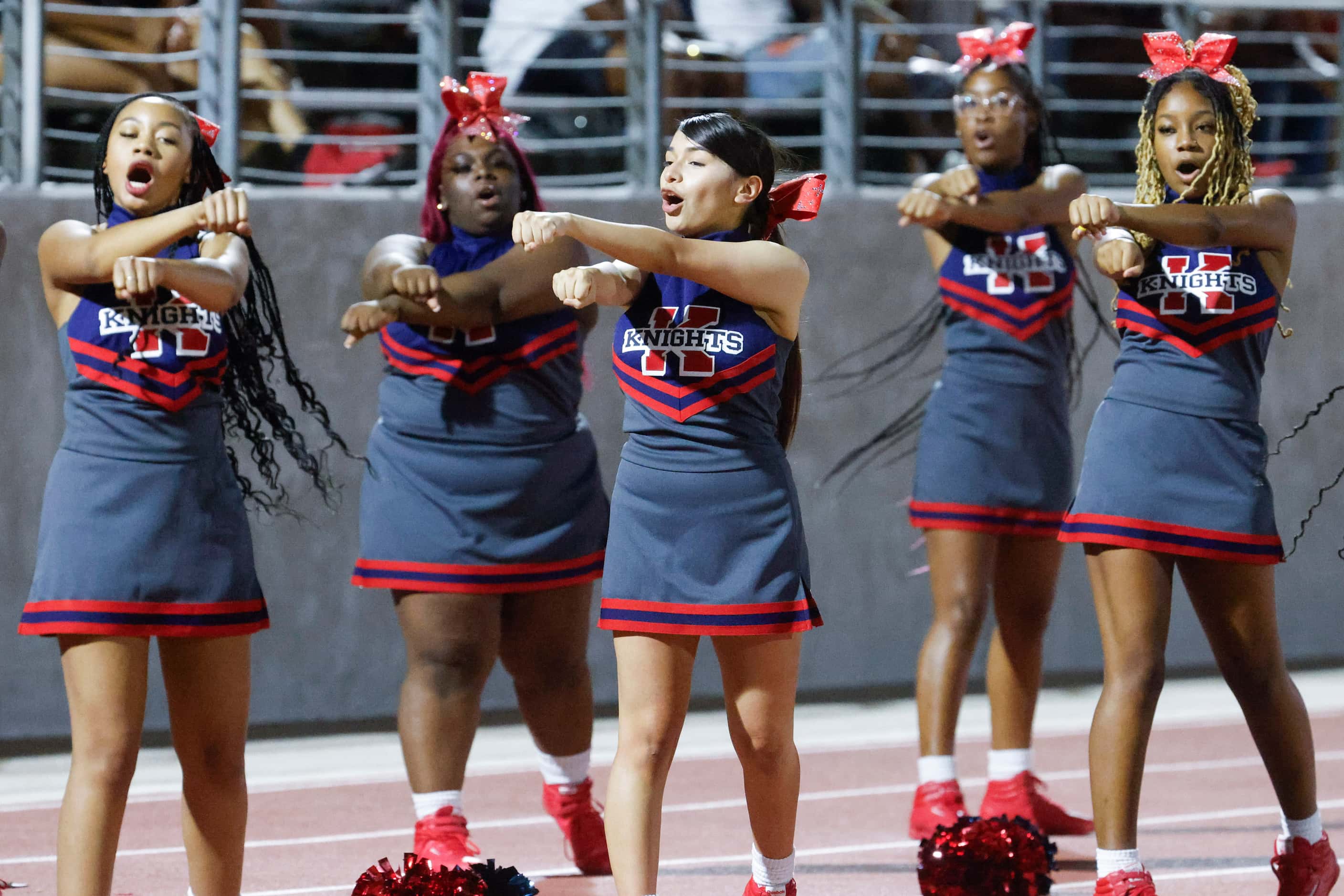 Kimball high’s cheer leaders perform during the second half of a football game against...