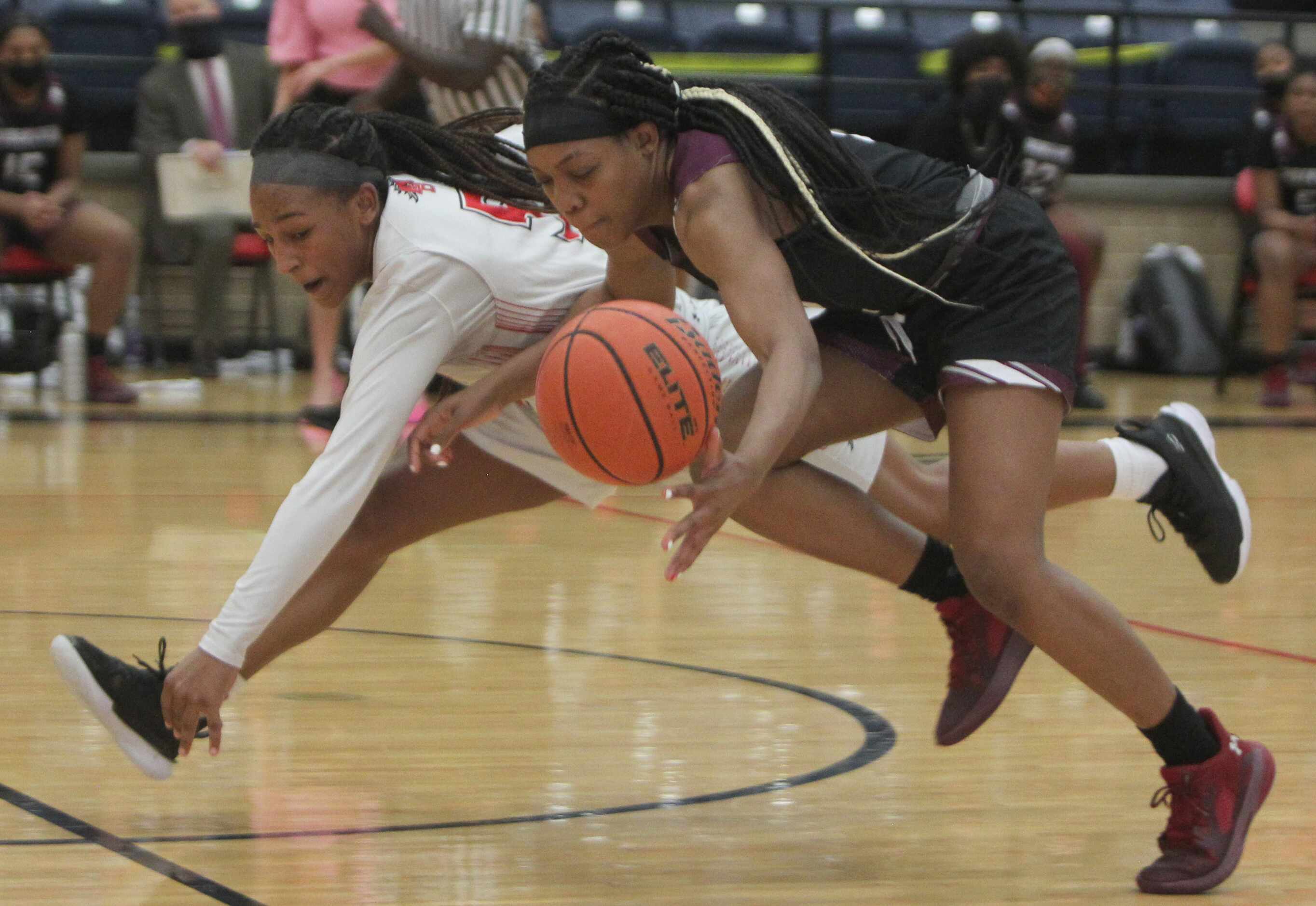 Mansfield Legacy guard Savannah Catalon (5), left, battles with Mansfield Timberview guard...