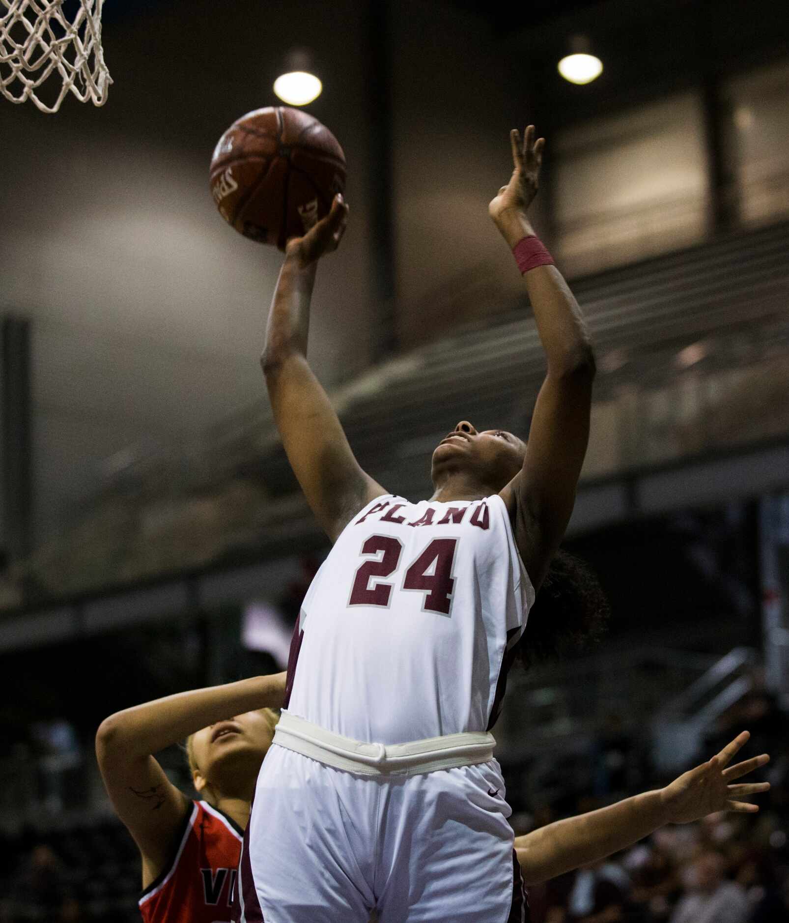 Plano forward Amaya Brannon (24) goes up for a shot during the fourth quarter of a UIL 6A...