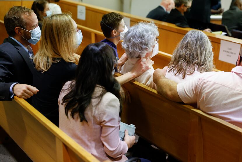  Anne Brooks, oldest daughter of Mary Brooks, was comforted by family members after she...