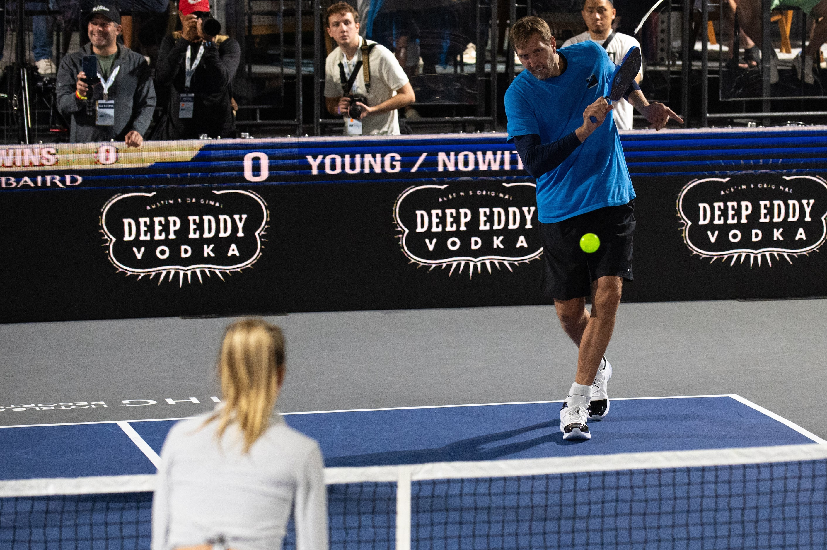 Former Dallas Mavericks center Dirk Nowitzki swings at a ball during a game versus...