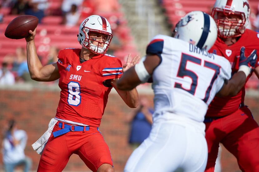 DALLAS, TX - SEPTEMBER 30:  Ben Hicks #8 of the SMU Mustangs drops back to pass against the...