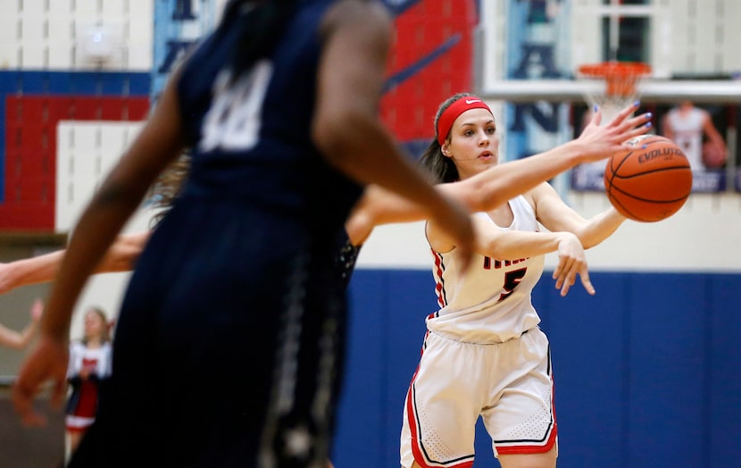 Centennial's Lily Crane (5) passes the ball in a game against Lone Star High School during...