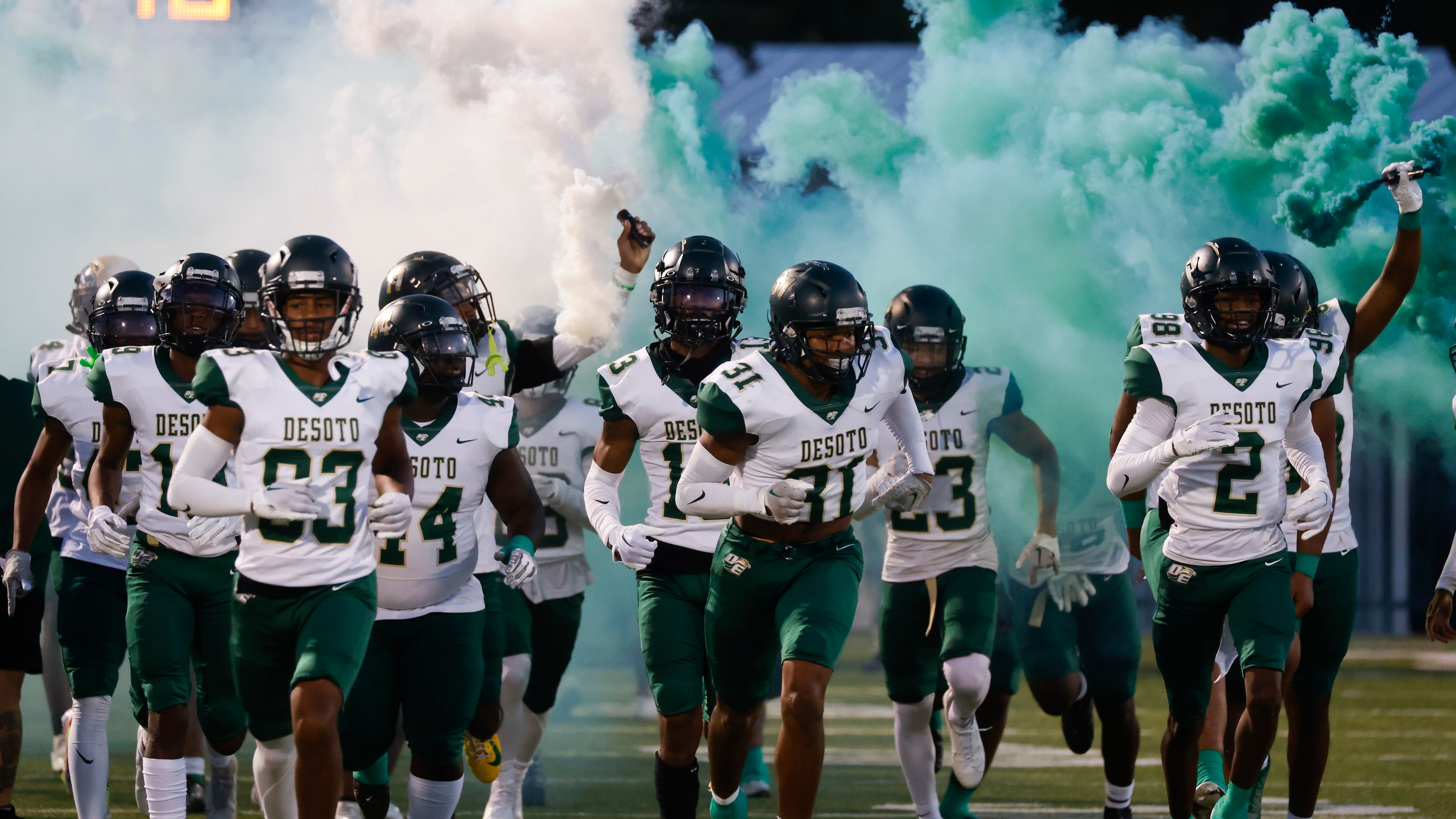 DeSoto high players enter the field ahead of their game against Lake Ridge High during a...