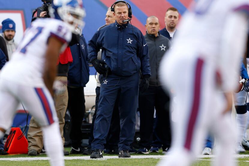 Dallas Cowboys head coach Jason Garrett watches as the New York Giants run their offense...