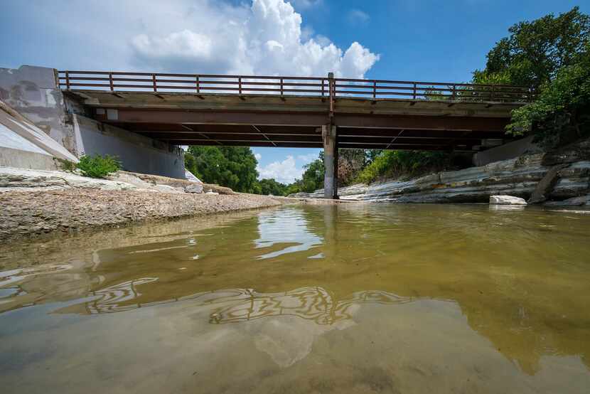 This bridge on  Briarwood Drive, which crosses over Duck Creek in Garland, is the focus of a...