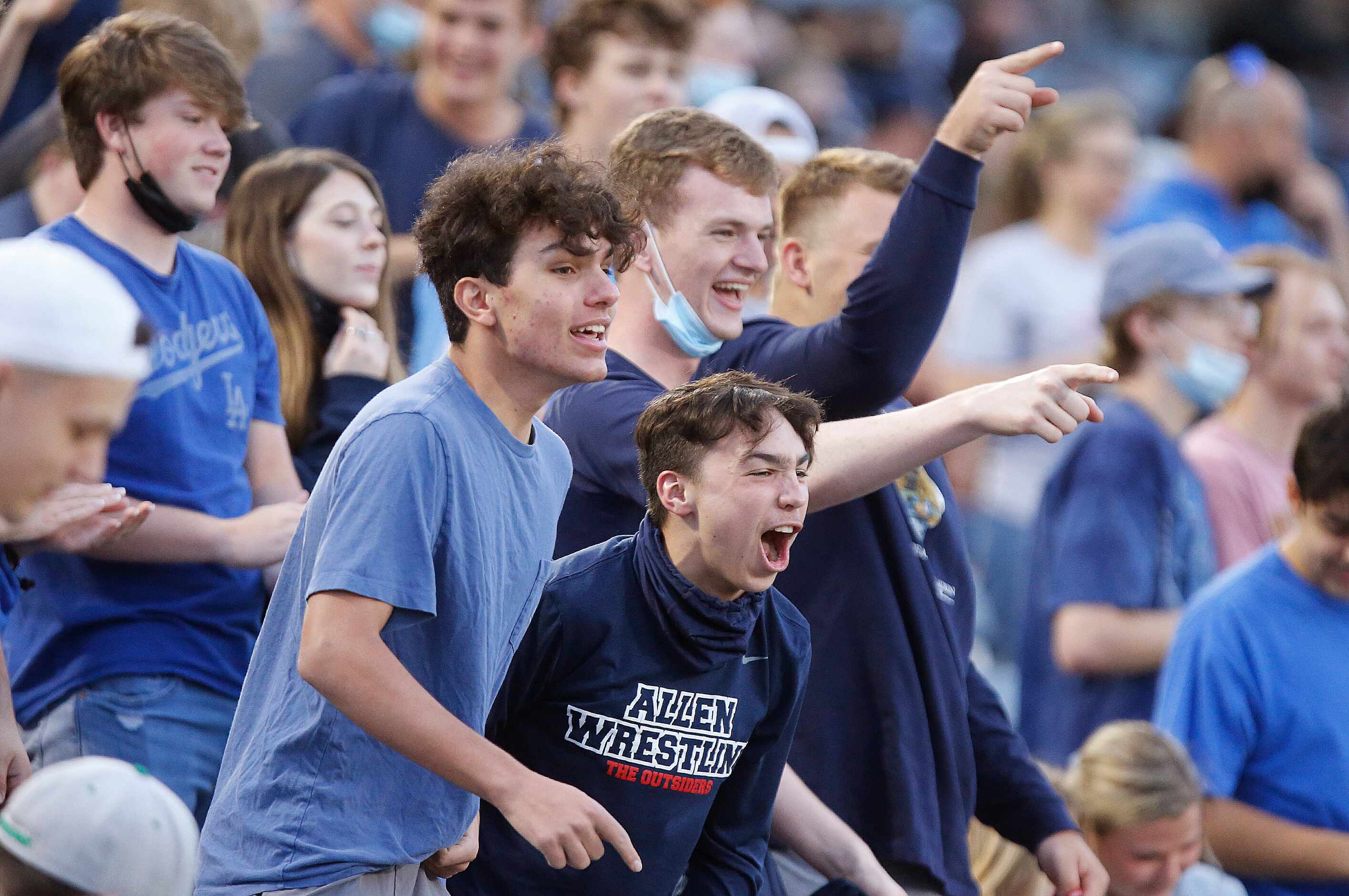 Allen students celebrate a goal by midielder Sam Presser to tie the game during the first...