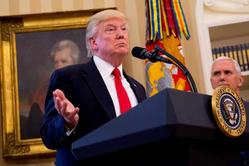 President Donald Trump speaks before signing executive orders, at the White House in...