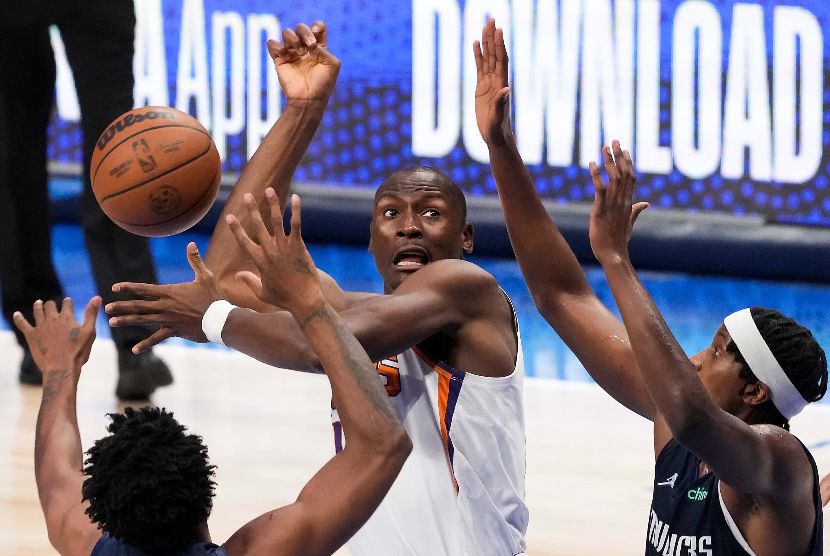 Phoenix Suns center Bismack Biyombo (18) loses the ball as he is defended by Dallas...