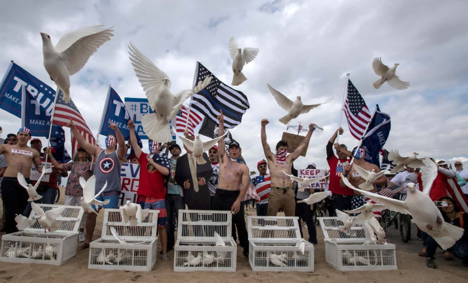 President Donald Trump supporters release doves during a march, in Huntington Beach, Calif.,...