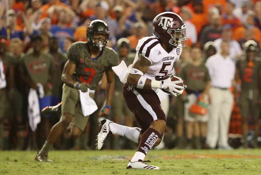 GAINESVILLE, FL - OCTOBER 14: Trayveon Williams #5 of the Texas A&M Aggies rushes for...