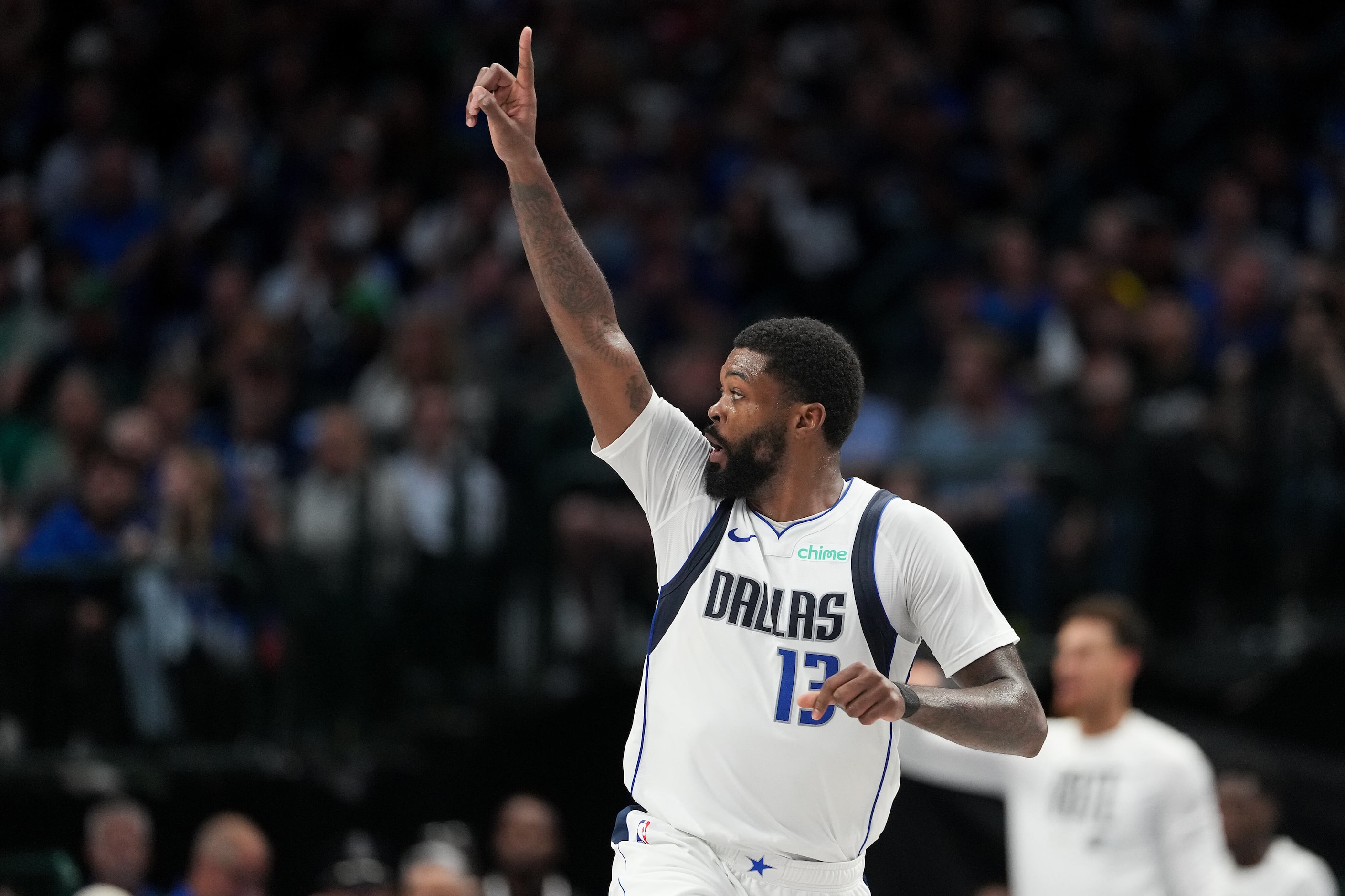 Dallas Mavericks forward Naji Marshall (13) celebrates after a basket during the second half...