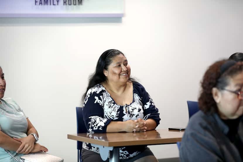 Susana Garcia listens during a class she was taking at the Buckner Family Center in Dallas,...