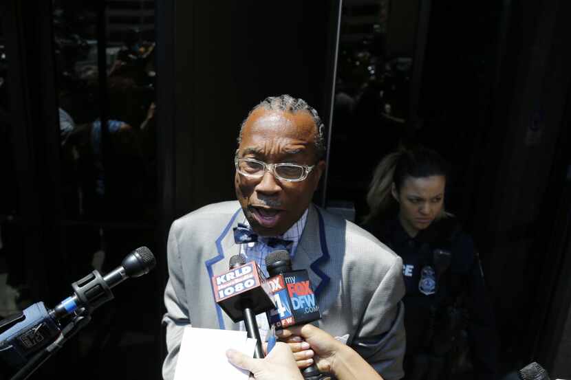 John Wiley Price talks to reporters Friday as he exits the Earle Cabell Federal Building in...