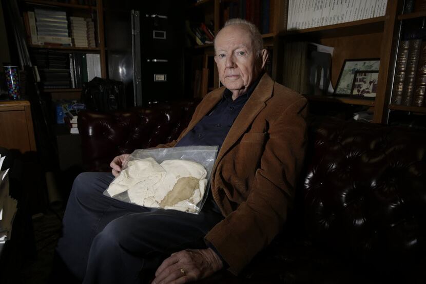 Dr. Robert McClelland holds the blood-stained shirt he was wearing on Nov. 22, 1963, when he...
