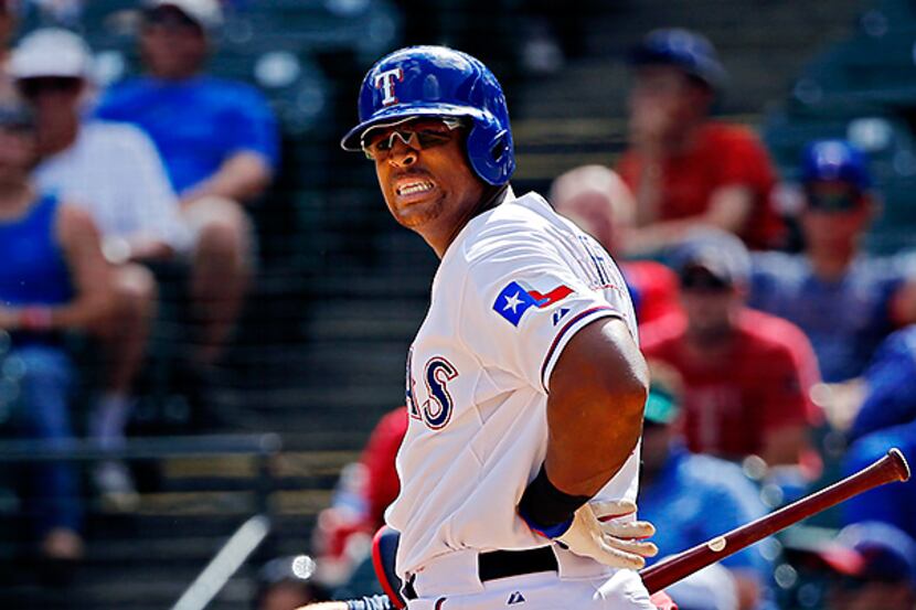 Texas Rangers third baseman Adrian Beltre reacts after striking out in the ninth inning...