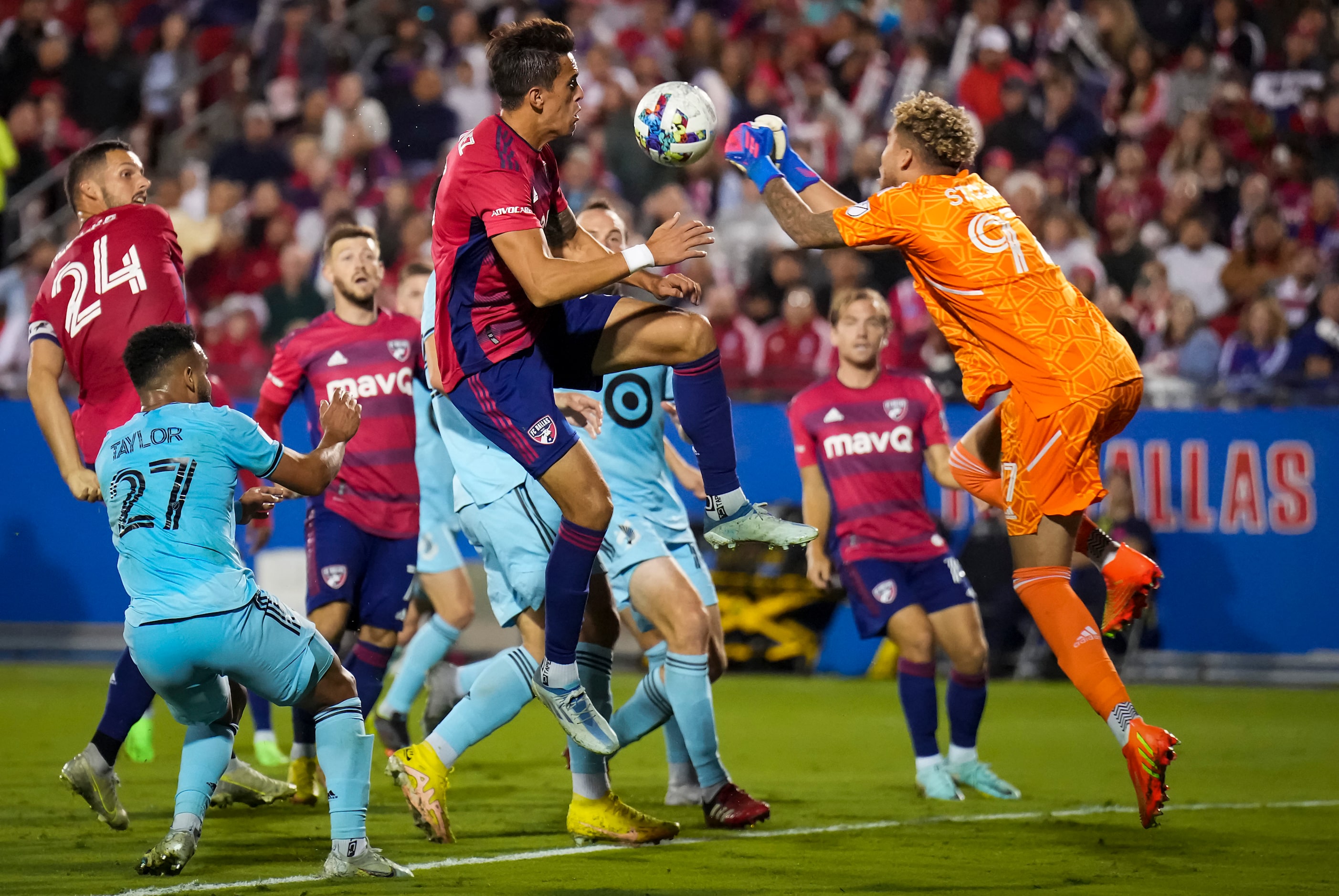 Minnesota United goalkeeper Dayne St. Clair (97) punches the ball away from FC Dallas...