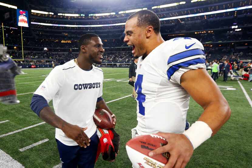Dallas Cowboys' Morris Claiborne, left, and quarterback Dak Prescott (4) celebrate after...