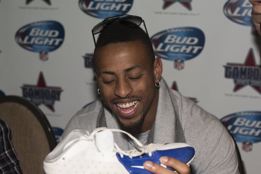 Dallas Cowboys Defensive End Greg Hardy signs autographs at The Owners Box inside the Omni...