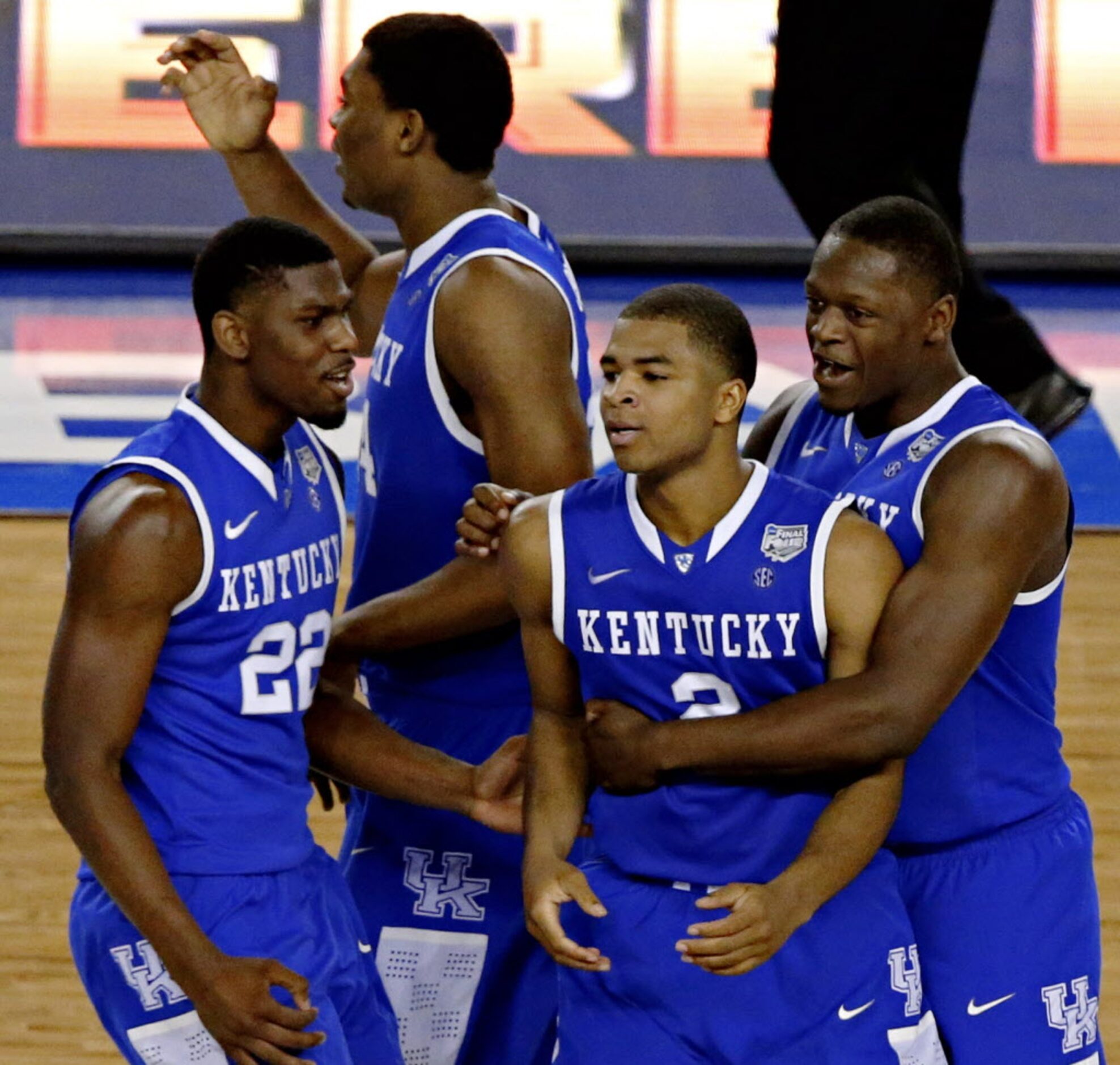 Kentucky Wildcats guard Aaron Harrison (2) is congratulated after scoring a game-winning...