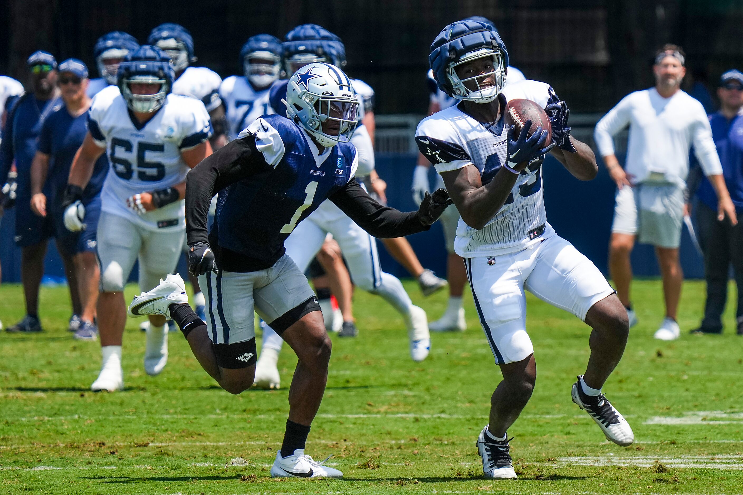 Dallas Cowboys wide receiver John Stephens Jr. (49) makes a catch as cornerback Kelvin...