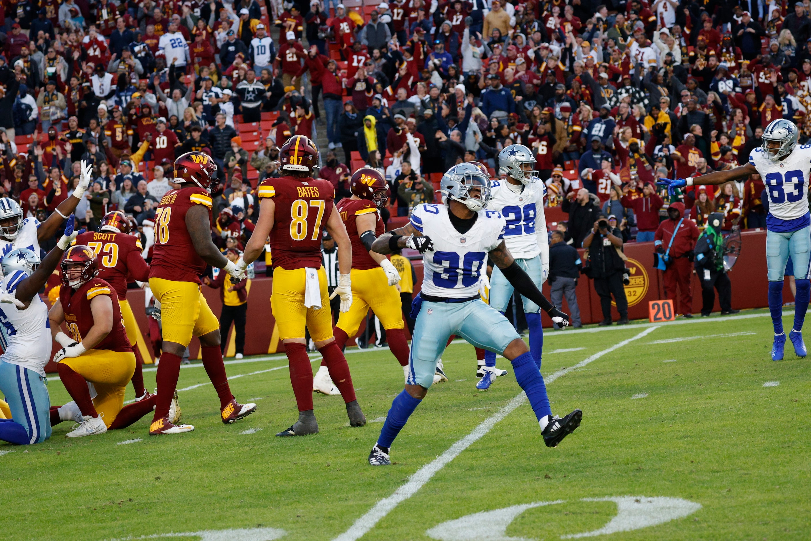 Dallas Cowboys safety Juanyeh Thomas (30) celebrates after scoring a 43-yard touchdown off a...