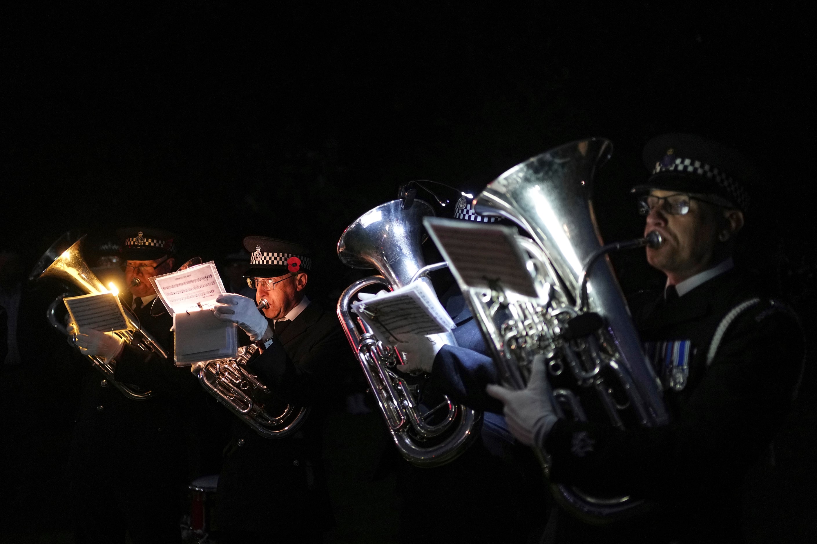 Musicians from the Pegasus Memorial Band perform during a ceremony as part of the 80th...