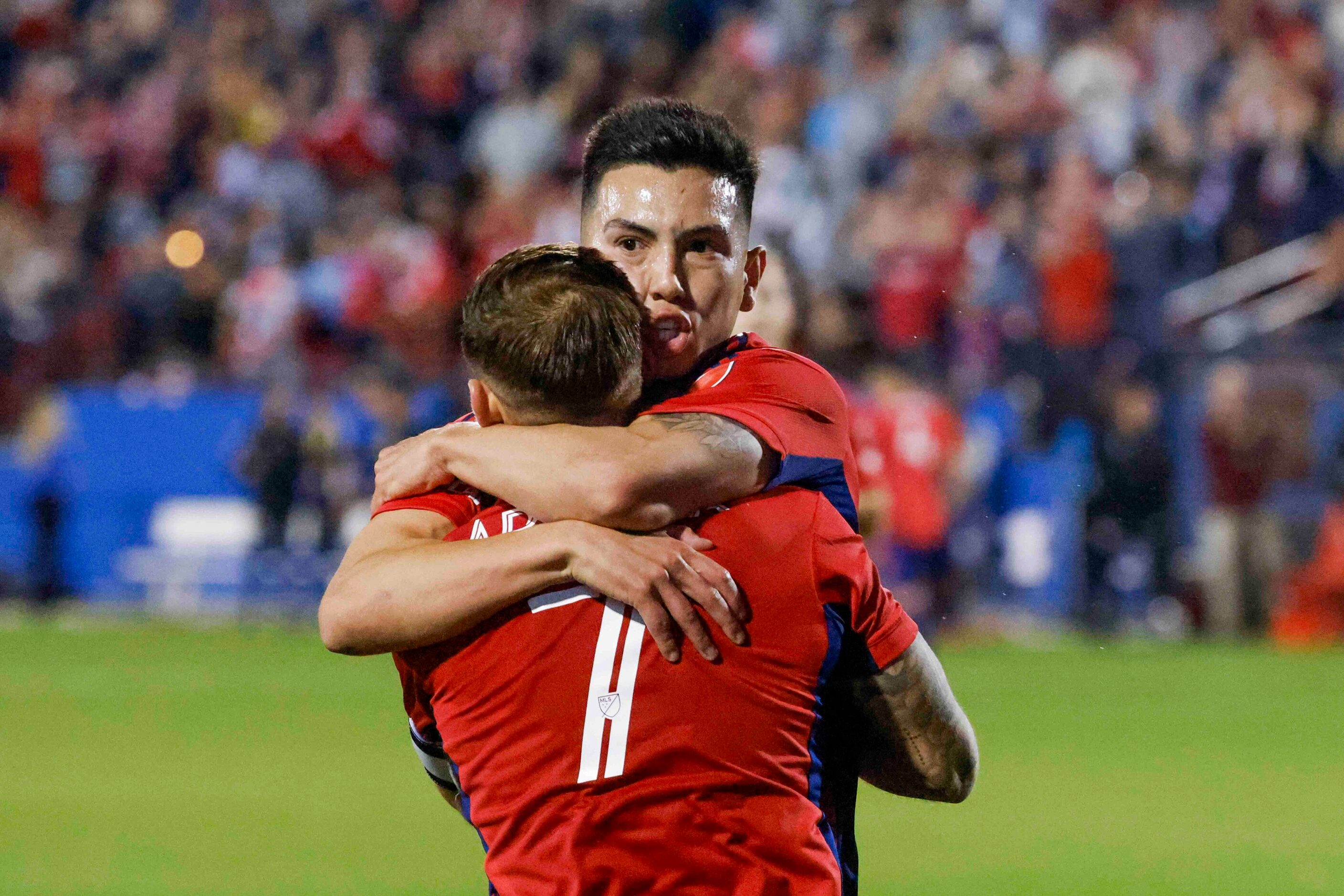 FC Dallas forward Alan Velasco (back) and forward Paul Arriola celebrates a goal during the...