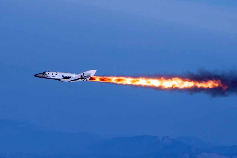 This photo provided by Virgin Galactic shows Virgin Galactic's SpaceShipTwo under rocket...