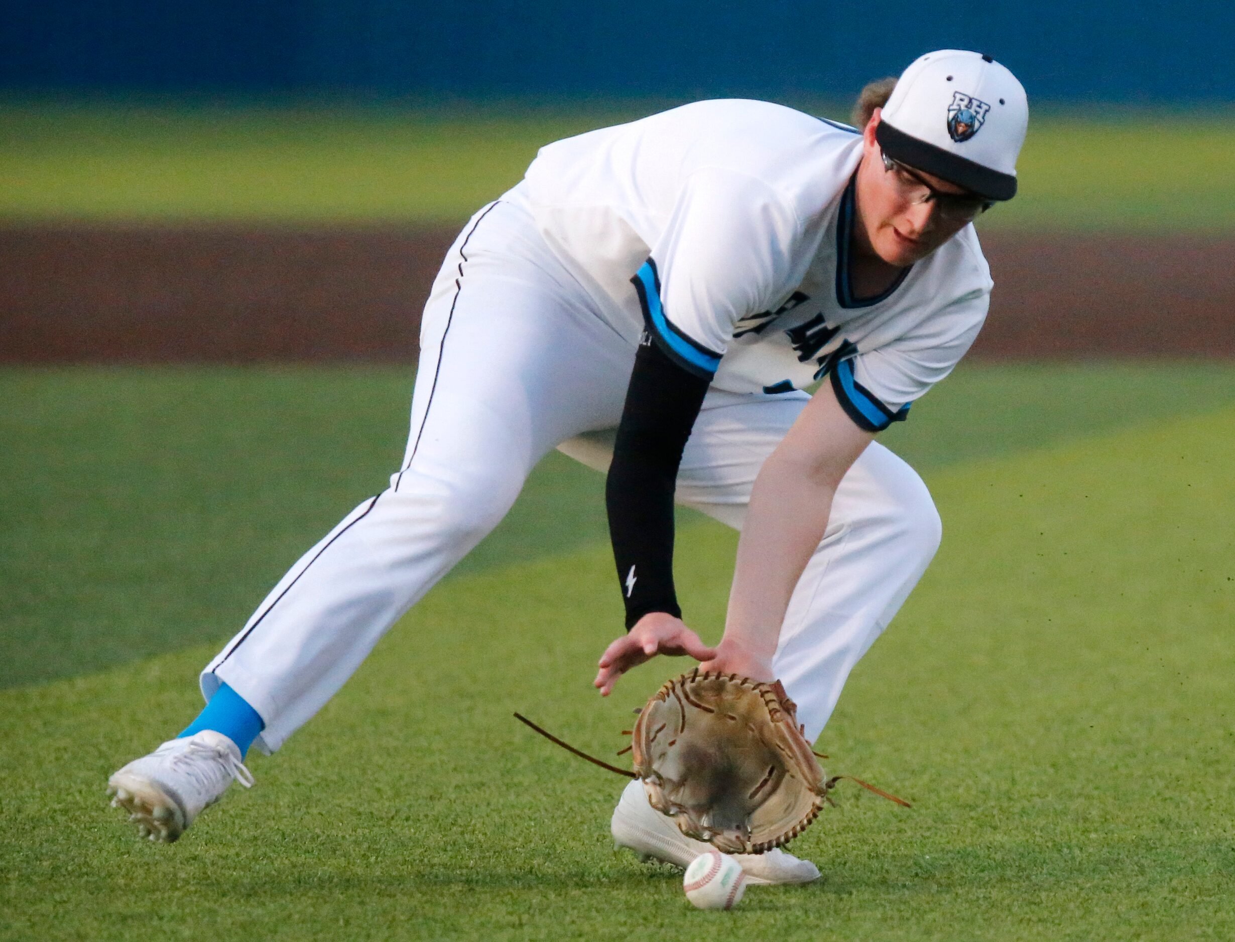 Rock Hill High School pitcher Zachary Rowley (9) fields a bunt but was unable to make the...