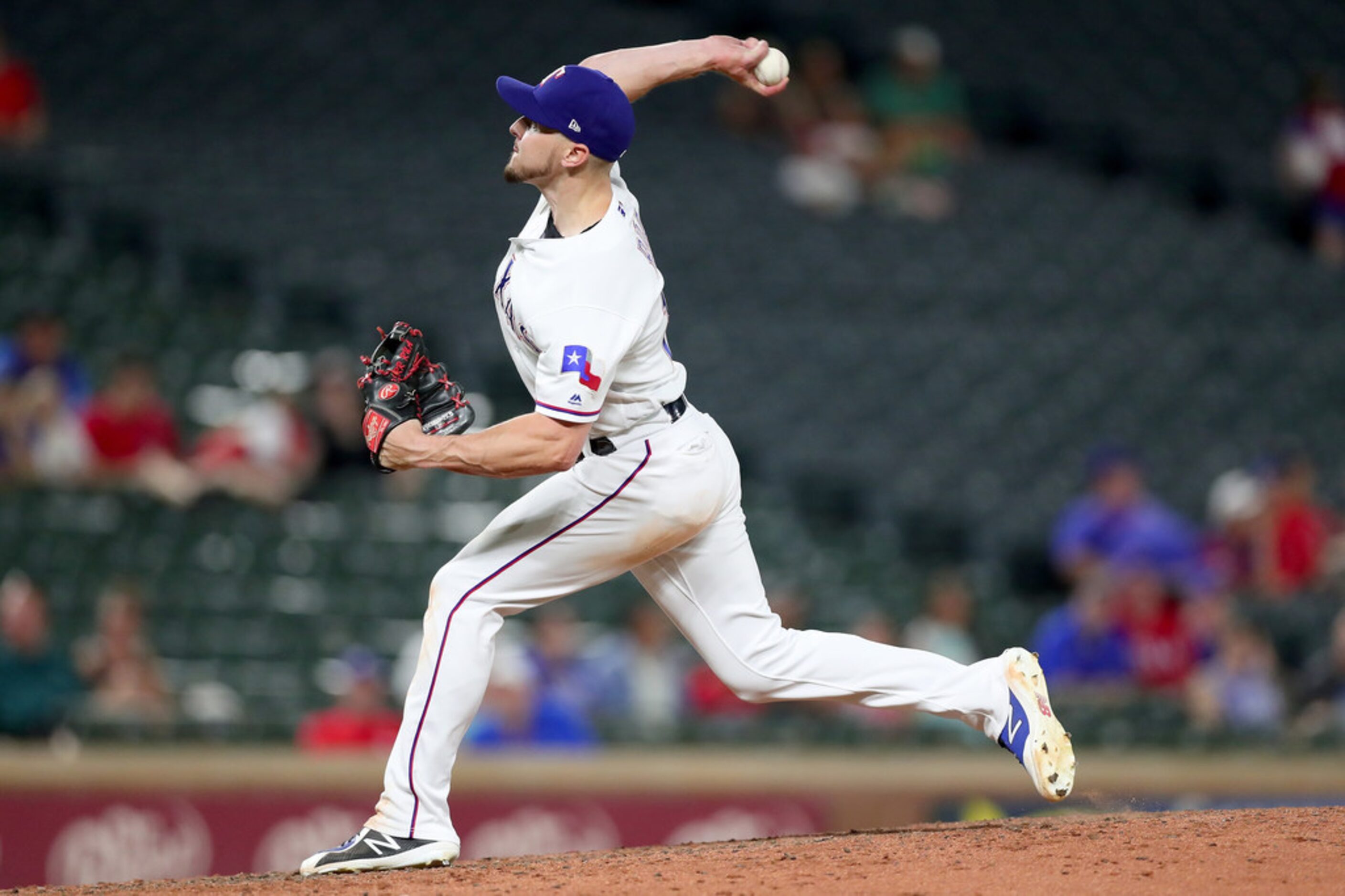 ARLINGTON, TX - JULY 23:  Ryan Rua #16 of the Texas Rangers pitches against the Oakland...