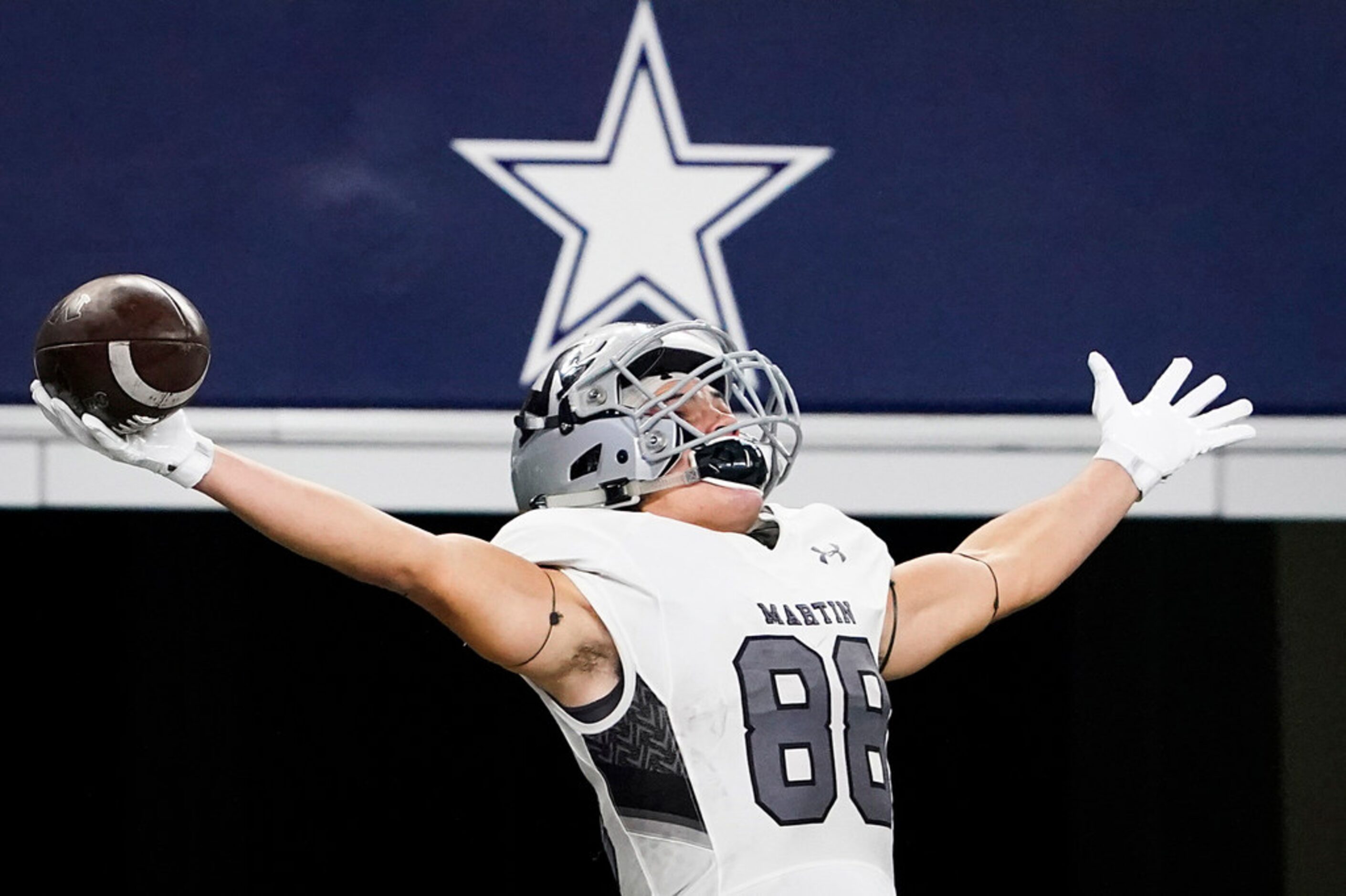 Arlington Martin wide receiver Jonathan Carter celebrates after scoring on a 44-yard run...