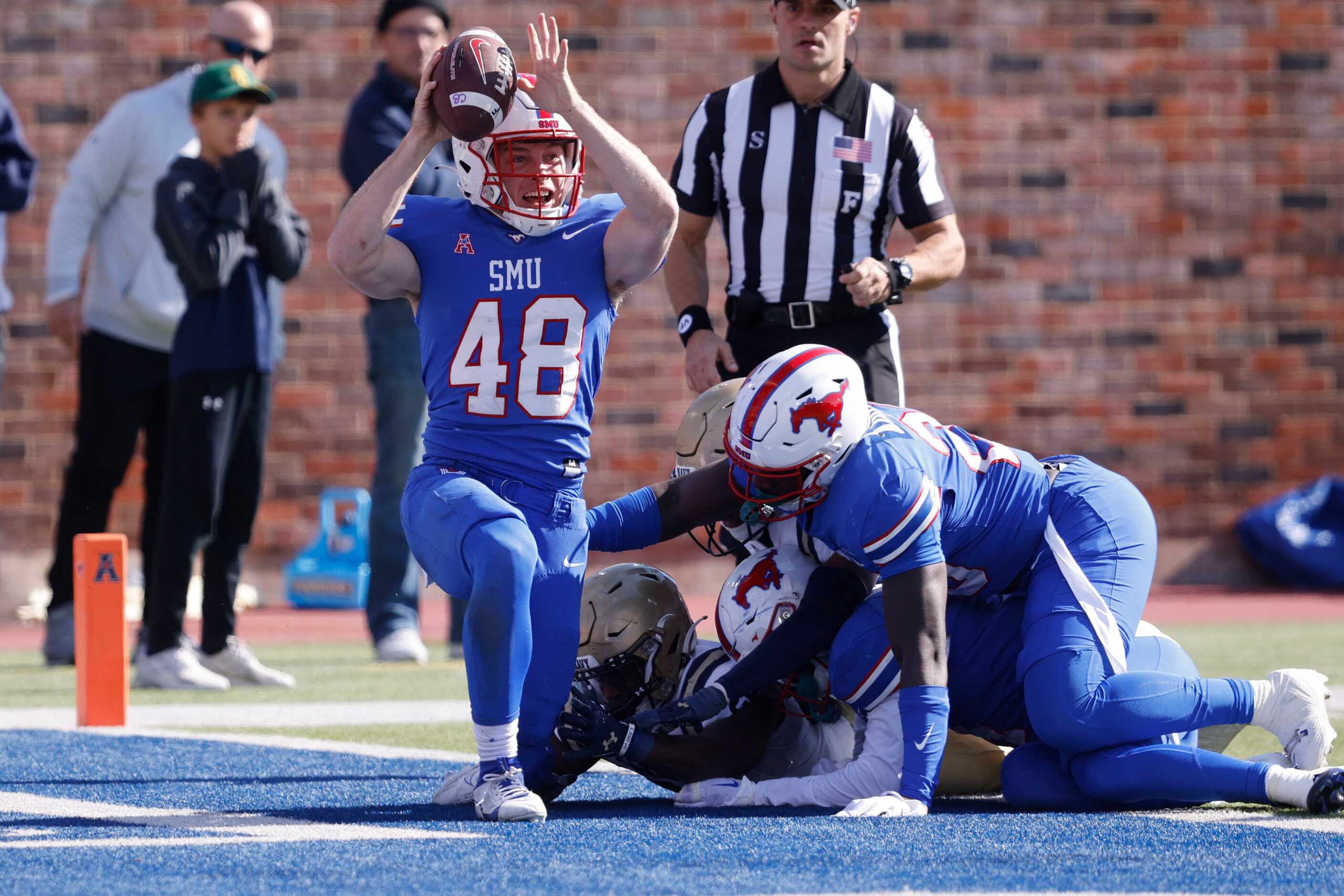 SMU long snapper Will Benton IV (48) celebrates after he scored a touchdown during the first...