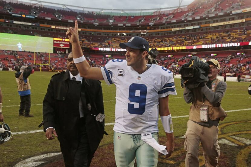 Dallas Cowboys quarterback Tony Romo (9) shares his emotions with the crowd after they...