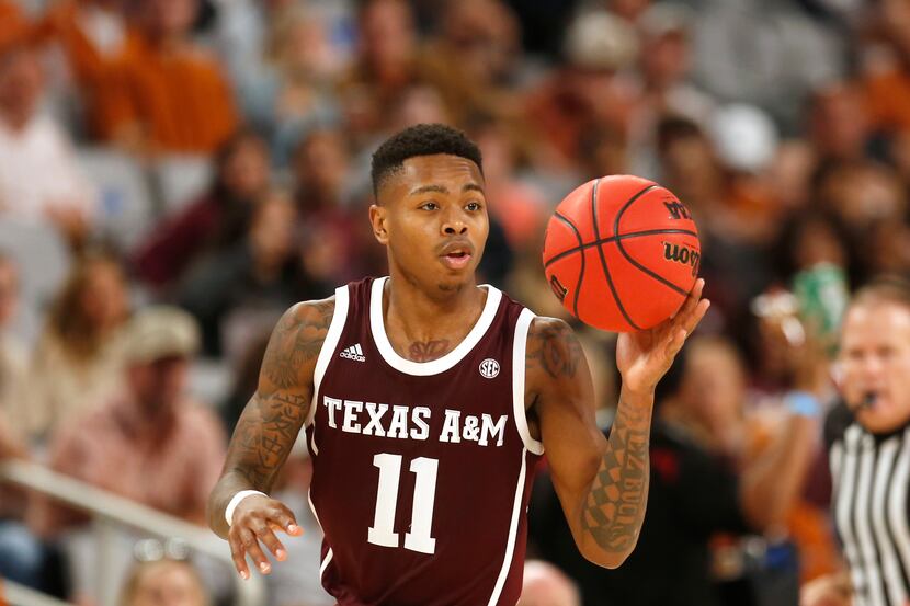 Texas A&M guard Wendell Mitchell (11) handles the ball against Texas during the second half...