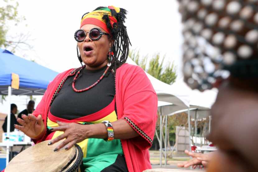 Afiah Bey performs in a drum circle at the 39th annual Harambee Dallas Festival at the...