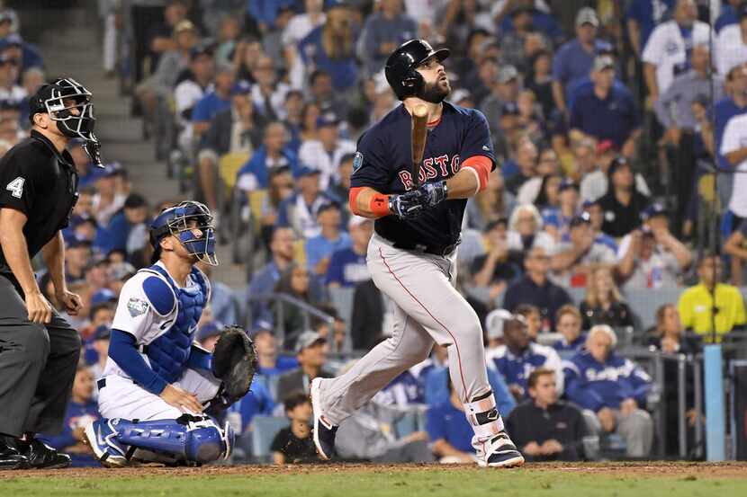 The Boston Red Sox's Mitch Moreland hits a three-run home run against the Los Angeles...