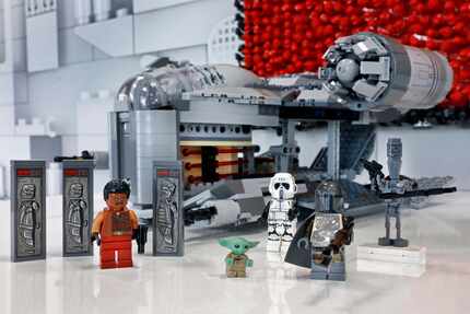 The LEGO 1,023 piece The Razor Crest, and collectible figures, are displayed at Toy Fair New...